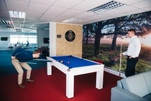 Playing pool in the office